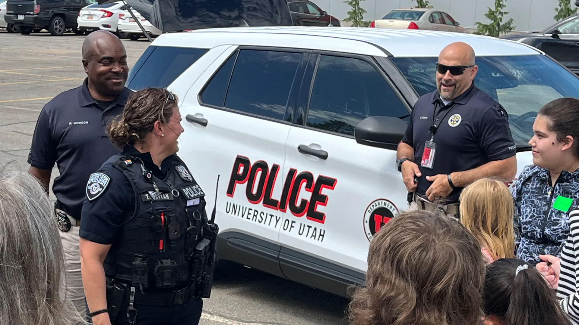 University of Utah Police Department officers with children at community event